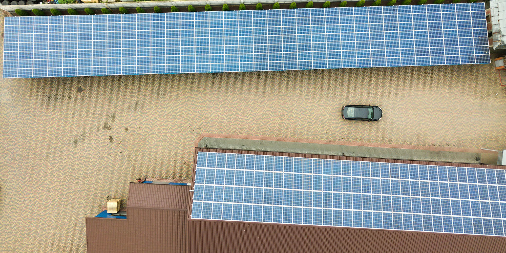 Row of house with solar panels on roof  on blue sky background. 3d illustration